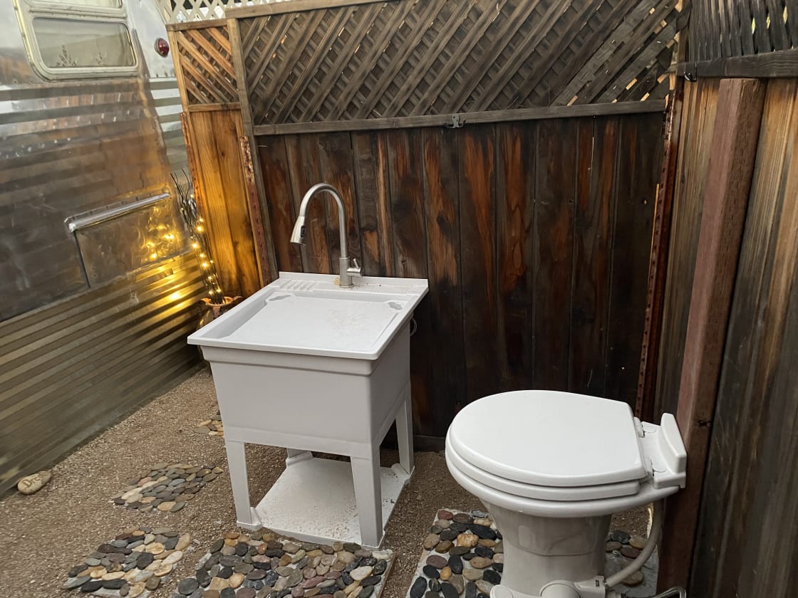 Outdoor rv toilet and utility sink - toilet is now enclosed