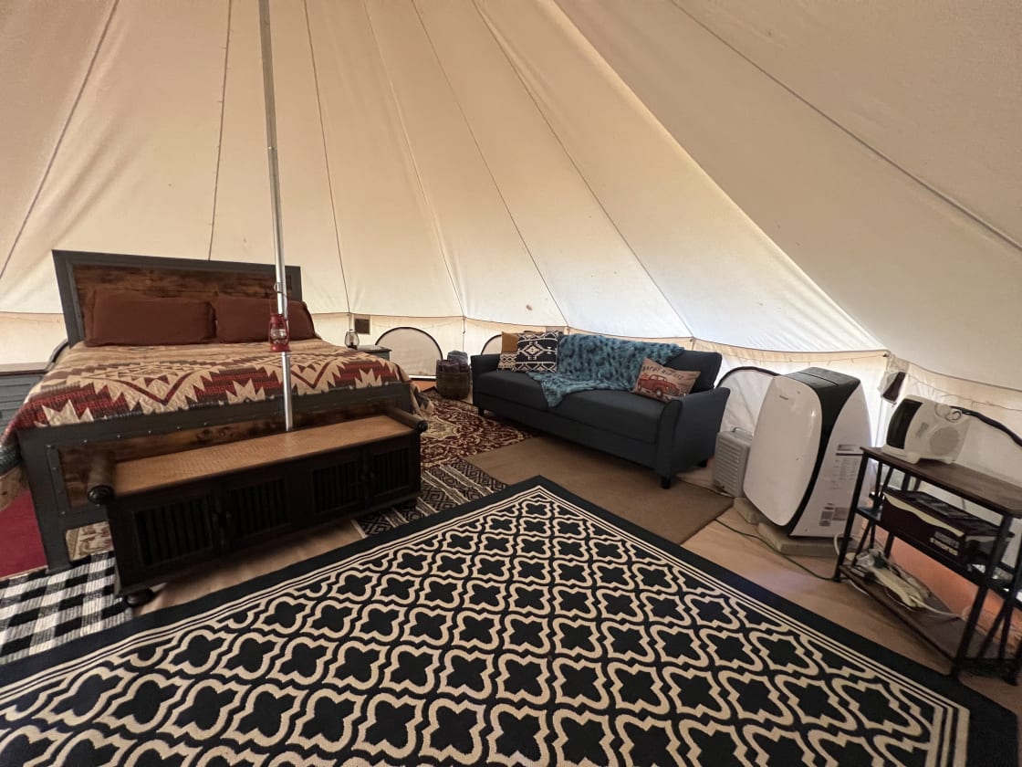 314 square foot heated and cooled bell tent with a queen bed. Heated blanket provides additional warmth in winter.