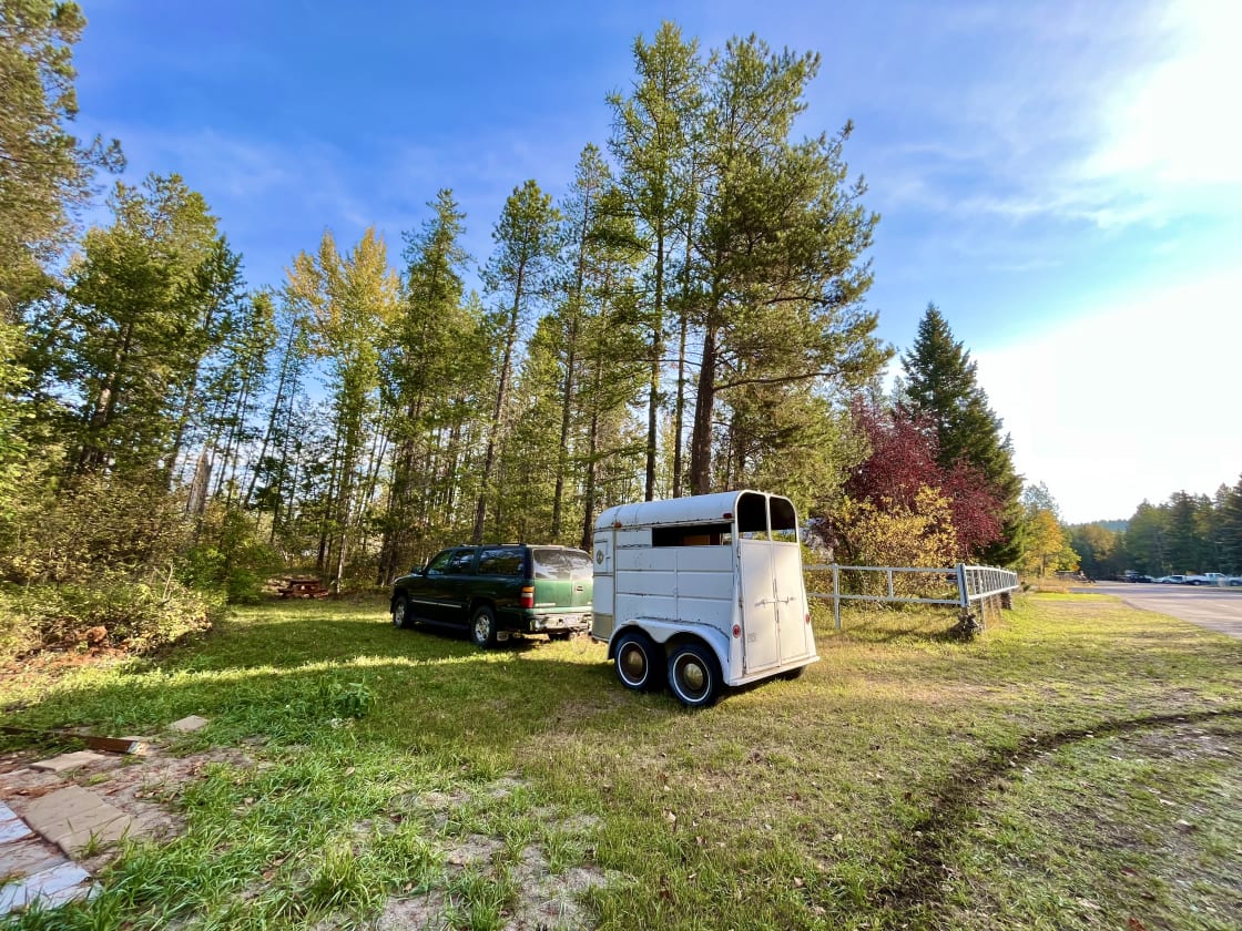 Front of site. Suburban and horse trailer for size reference