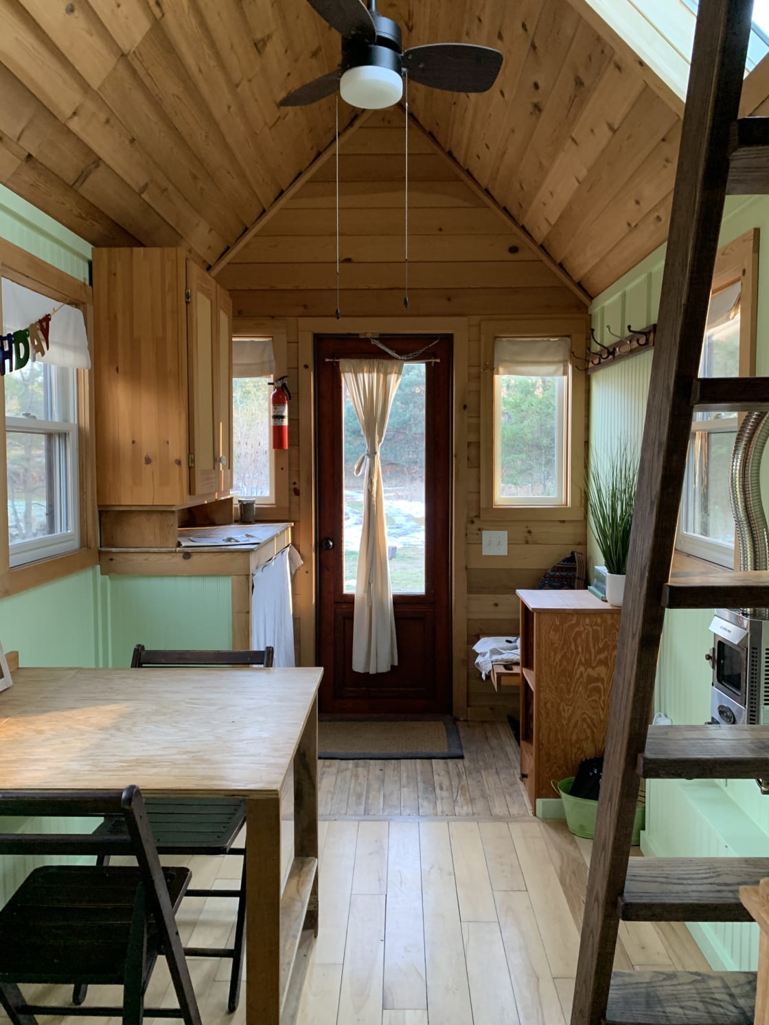 Inside of the tiny house standing in the kitchen.