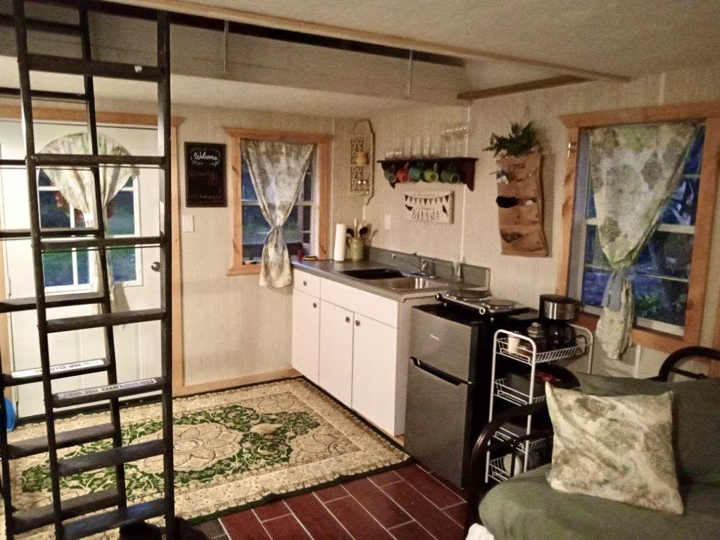 Cozy kitchenette. Complete with 2 burners, fridge, air fryer, crock pot and an old style electric fryer

