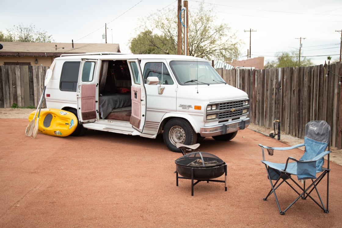 Typically an RV would pull straight back parallel to the fence; vans have more wiggle room.
