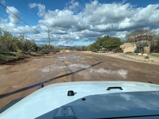.3 miles of dirt road before our property.  Drive slow after a recent rain.  