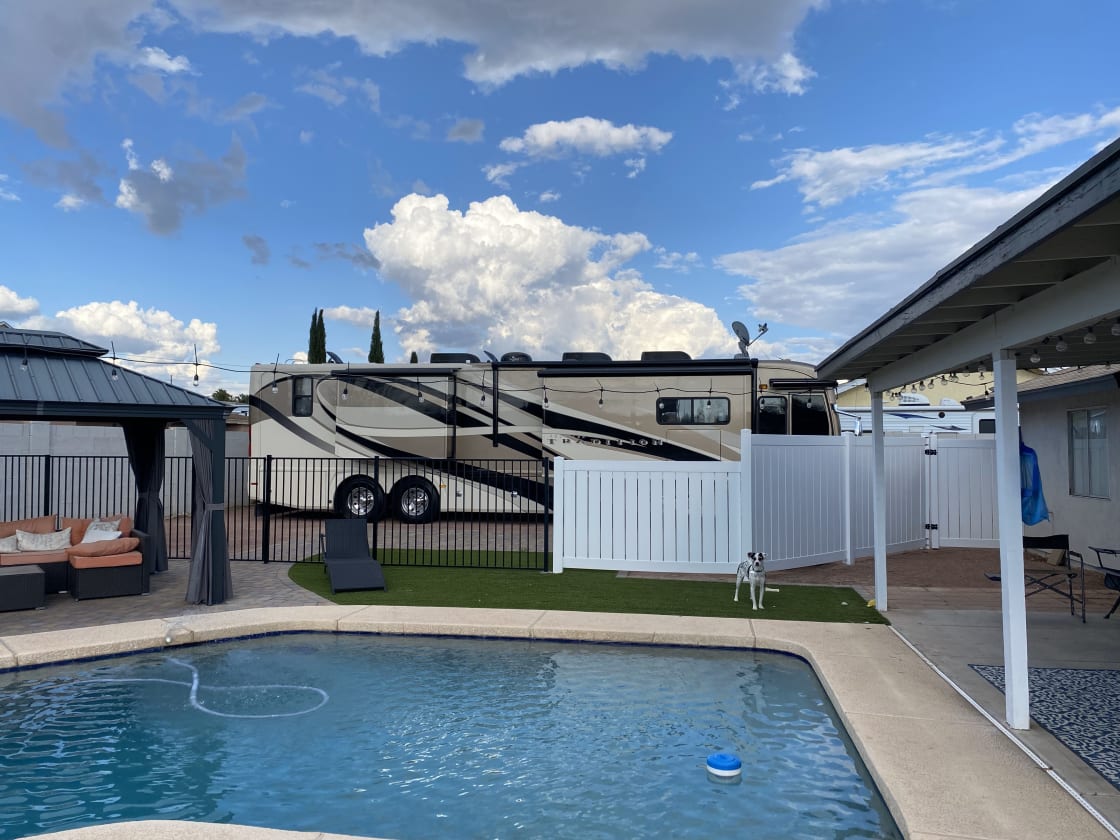 RV space fenced and pool accessible. 80' plus space and very wide.