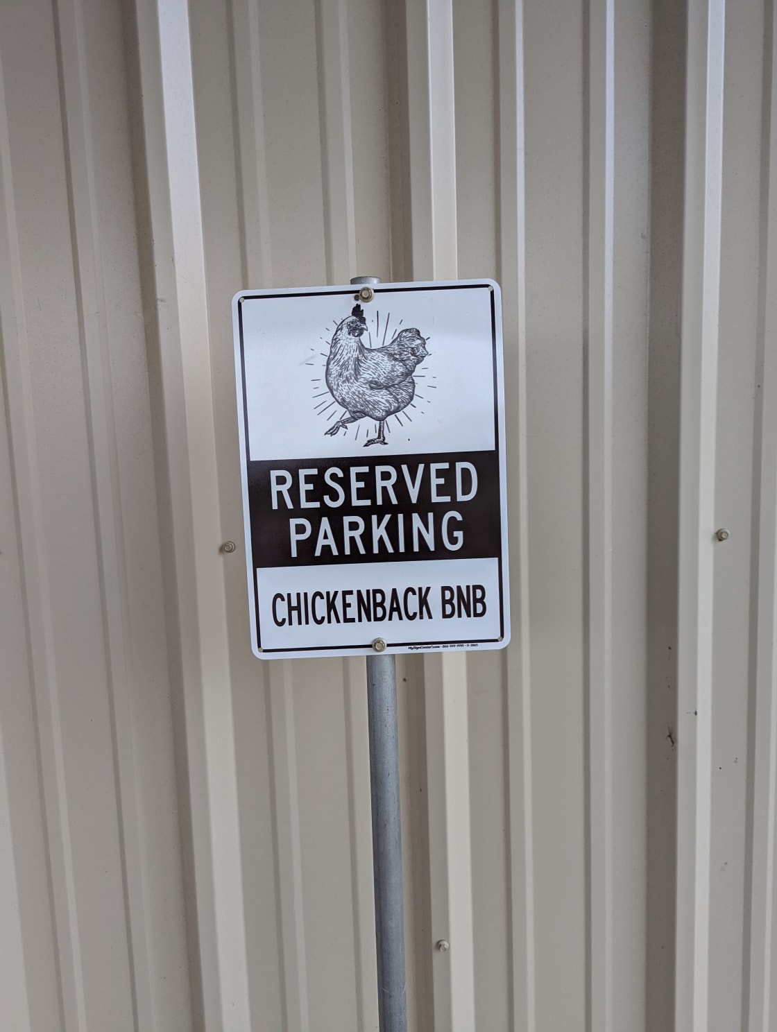 Reserved parking in front of the shop and camper is to the right (west side). Allows for sneaking in under the radar of resident chickens. 