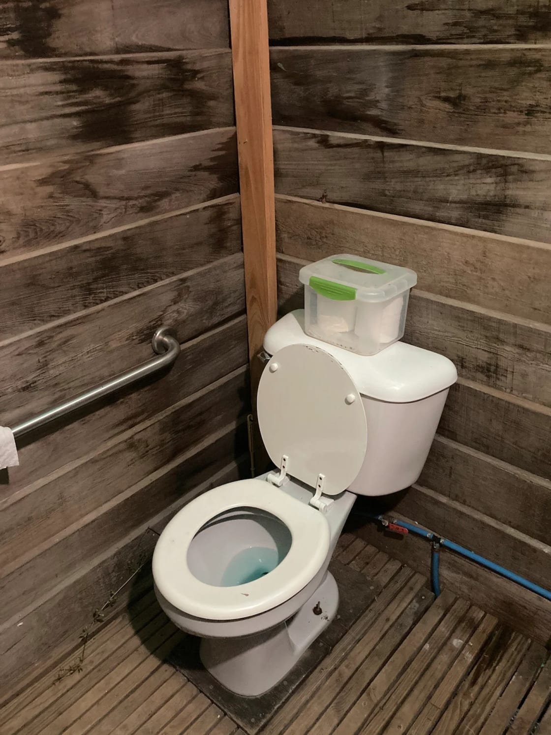 Flush toilet in outhouse