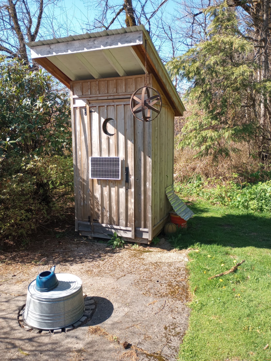 Composting toilet and firepit