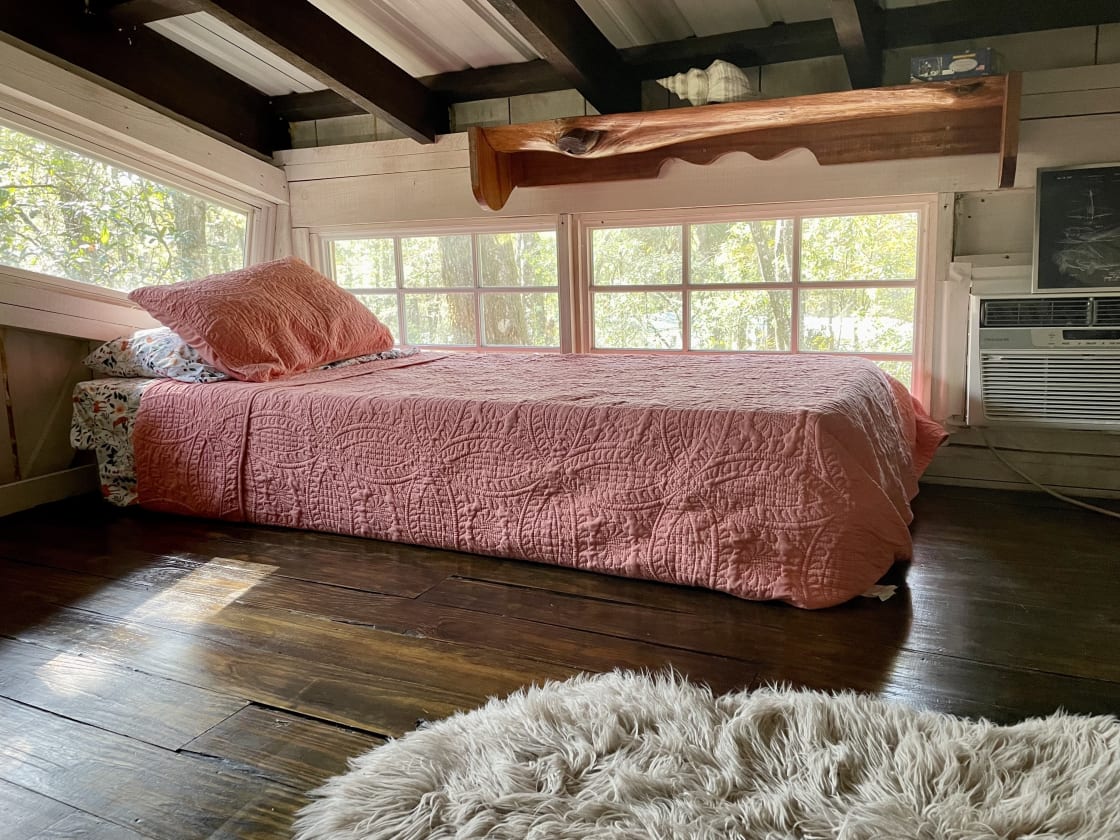 Single bed in the loft of the treehouse