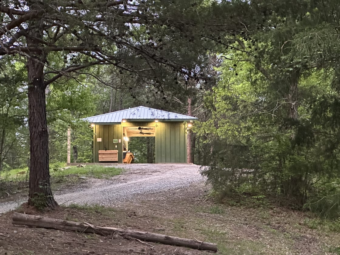 Upscale Bathhouse beside Glamp and RV Sites with private restrooms and endless hot showers!  Pond campsites are .4 miles away but have porta potties.