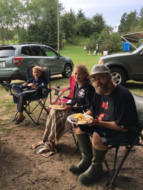 Happy campers at the picnic area near the parking lot