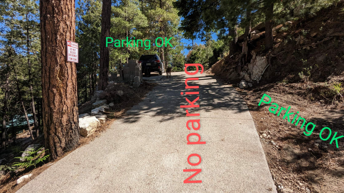 Park below the properties on Ray Ave, in the half moon driveway, or on the approach to the site