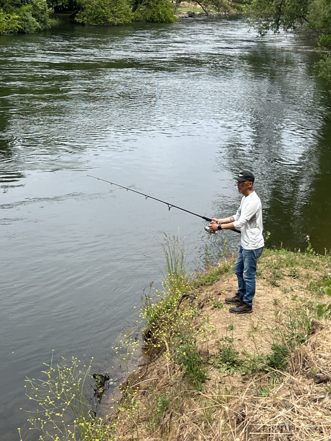 Fishing along the riverbank