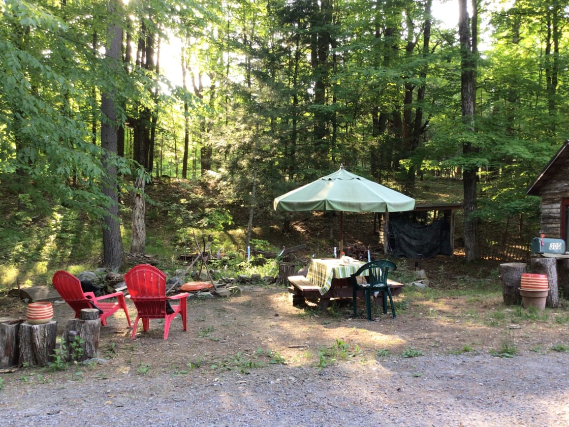 Tent site is next to a small cabin, this flat area is good for a tent and campfire.   We offer outdoor cooking tools and help getting started.