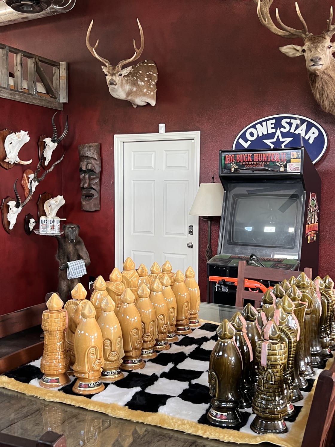 1960s Old Crow Whiskey empty bottle chess set 
Big Buck Hunter working arcade 