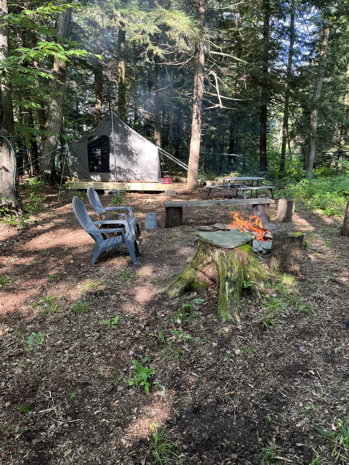 Basecamp-  Fire pit, outhouse and waterproof 4 season canvas tent. 
Plenty of fallen wood for fires, can purchase bundles of wood for an additional fee- cash or Venmo. 