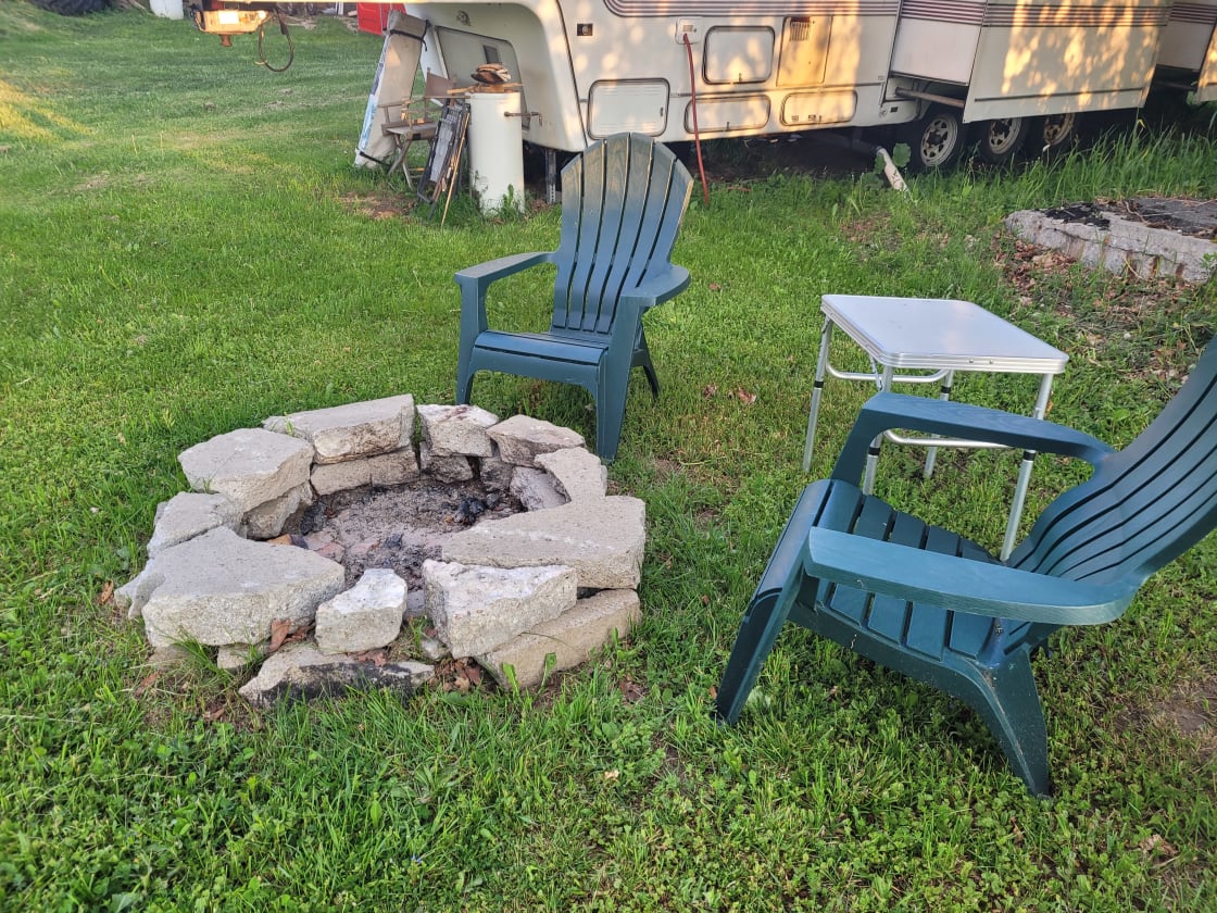 What's camping without a firepit? There's wood provided under the plastic and the camper.  Also, a few more chairs!  Please DO NOT take wood from the wood pile.   There's plenty along the roadside as well.