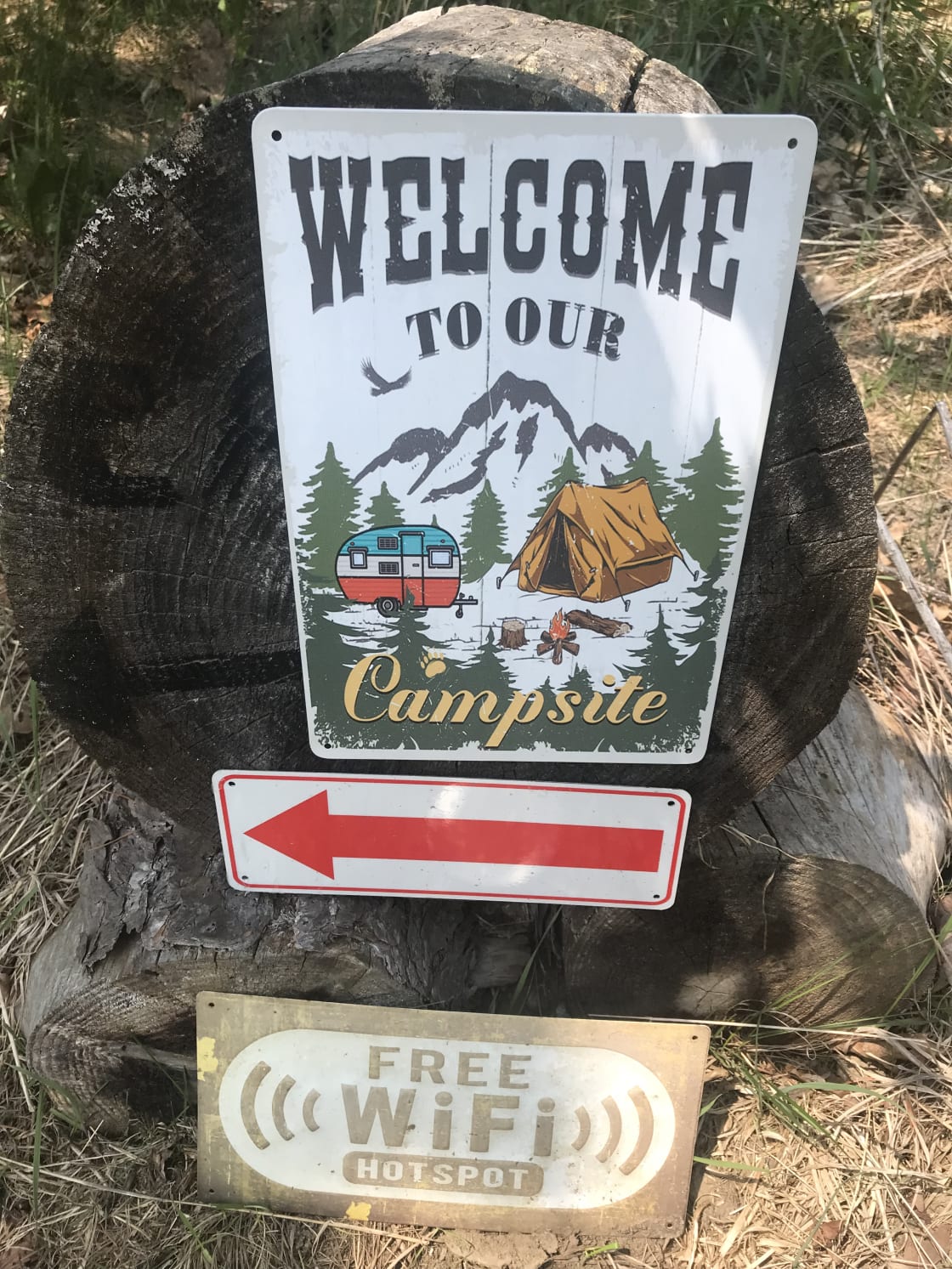 Campsite sign near driveway