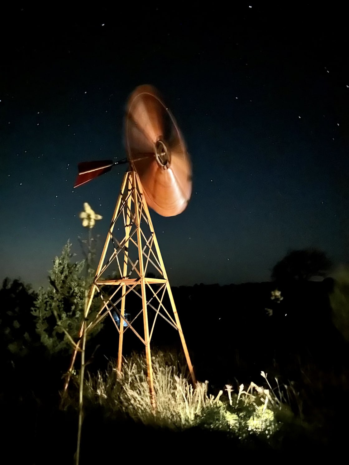 The wind chime and spinning windmill provide serene lullabies for countryside lounging.
