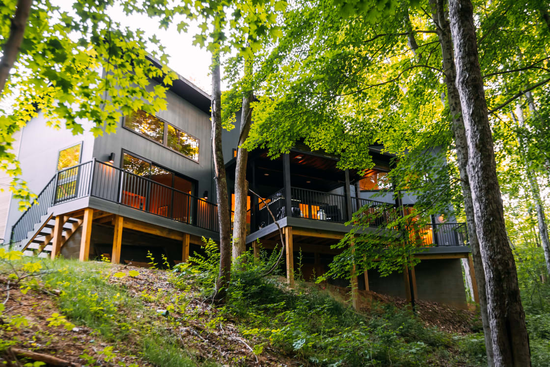 Expansive views overlooking the forest and ravine with seasonal creek.