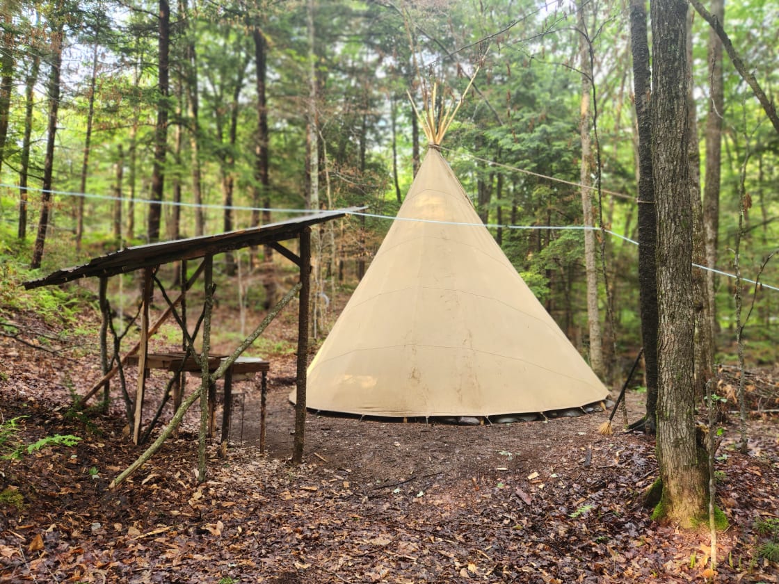 Tipi by the brook