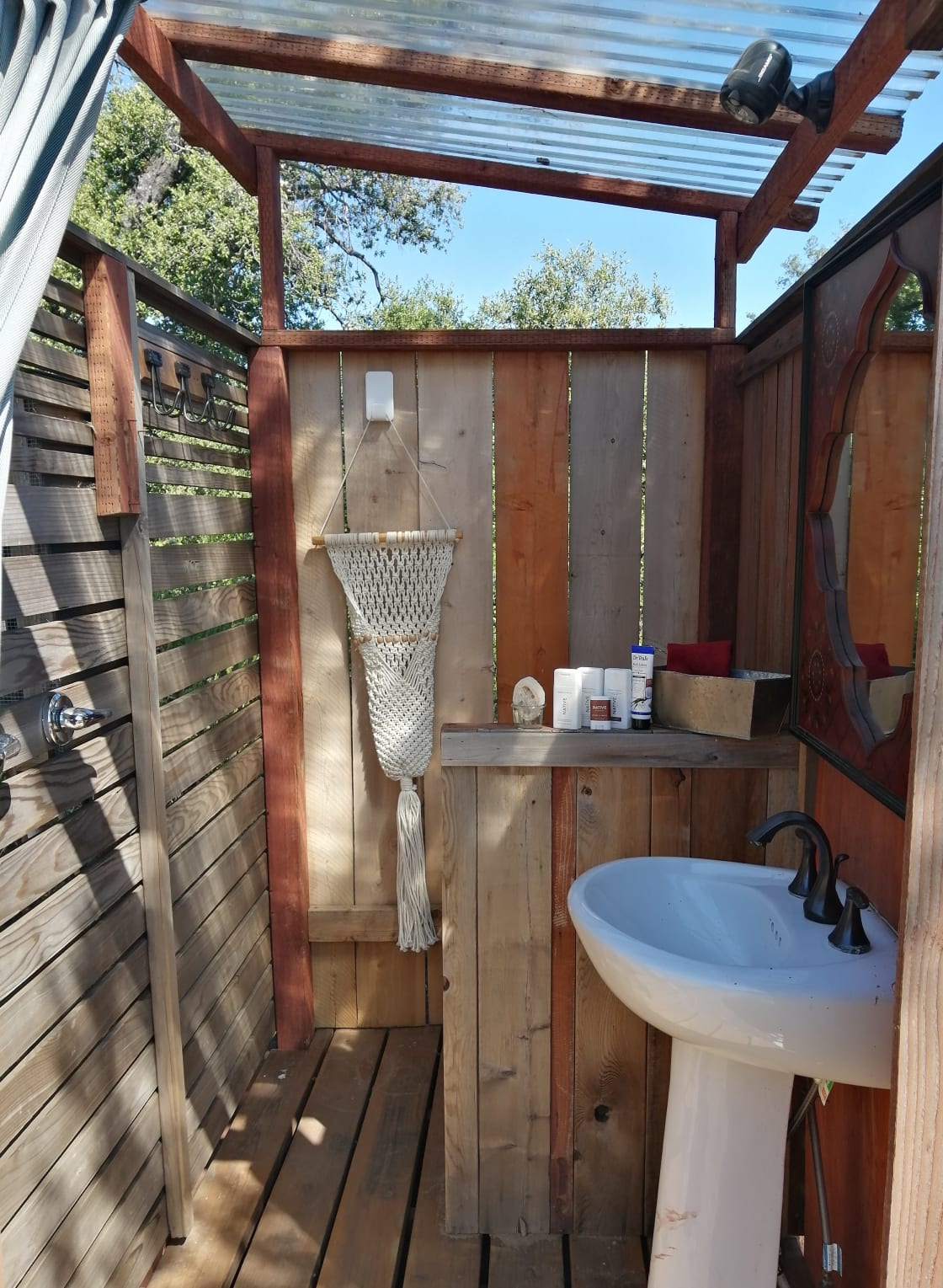 Outdoor bathroom is right of Shiva cabin just off the deck. It has a hot shower and composting toilet