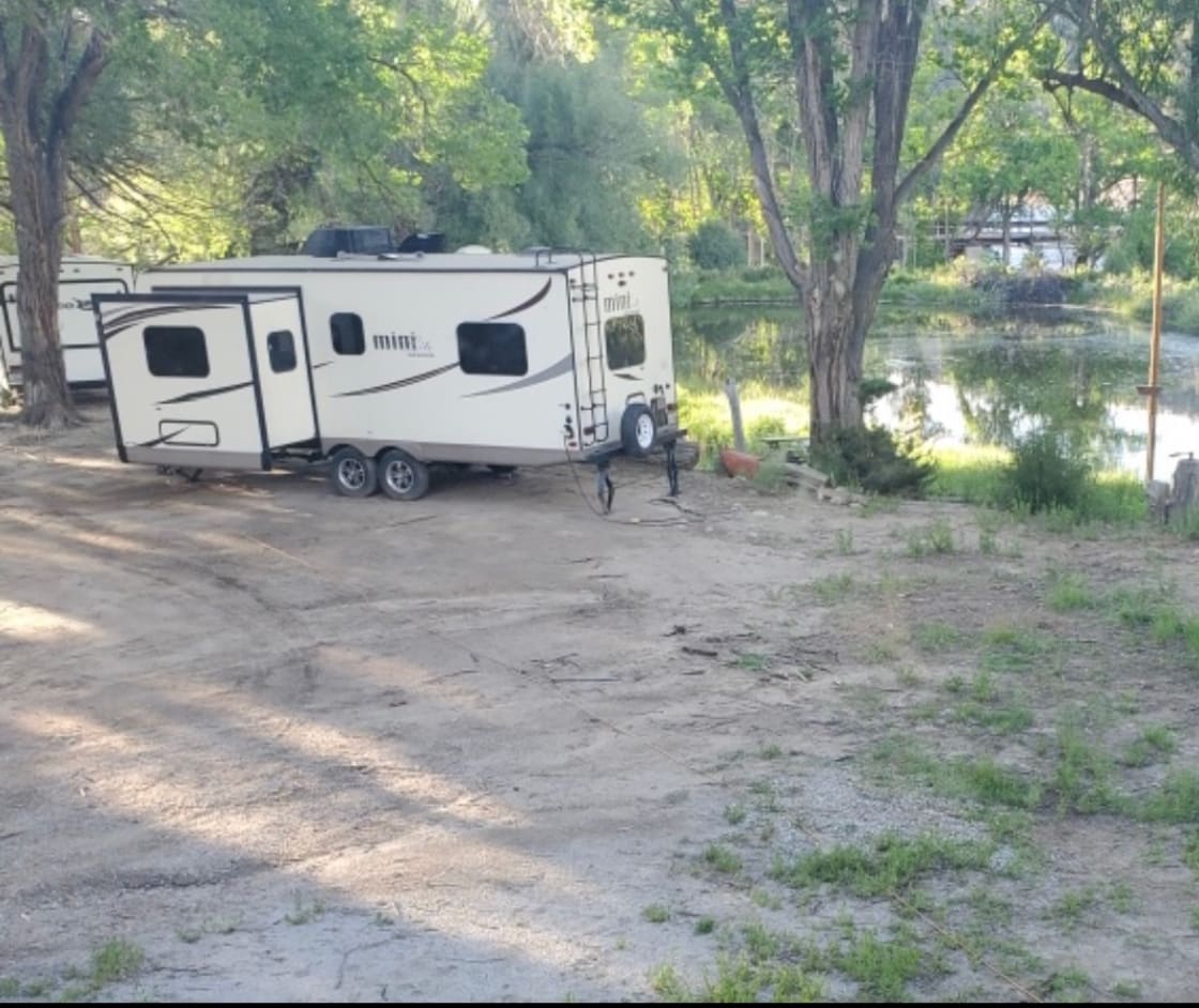 Not sure about camping? Rent our camper at Twin Bridges! Sleeps 4. Next to the pond and steps from the river. Brown trout site is located next to this camper.