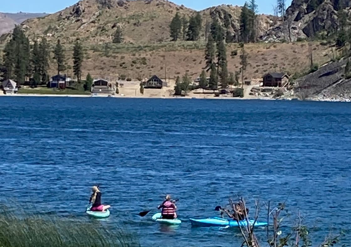Paddle Boarders taking off for a stroll around the lake