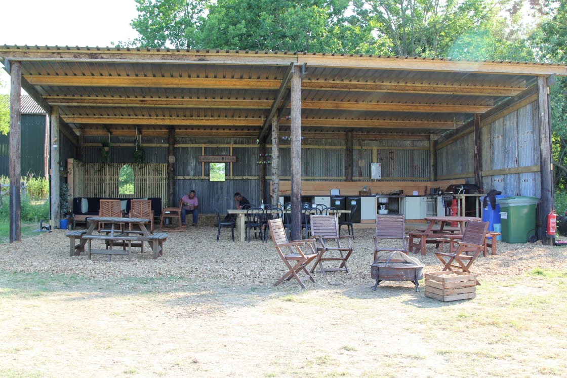 Keep out of the sun or rain in our converted tractor shed kitchen, seating and dining area