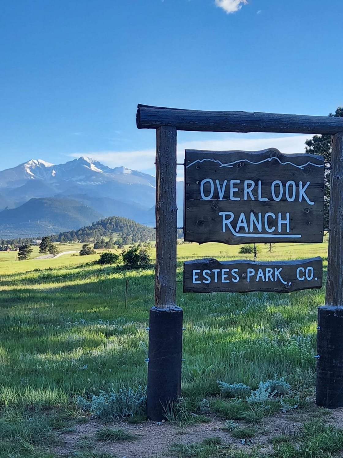 Sign at Entrance.  Mt. Meeker (13,916 Ft) and Long's Peak (14,259 Ft) to the left of sign. 