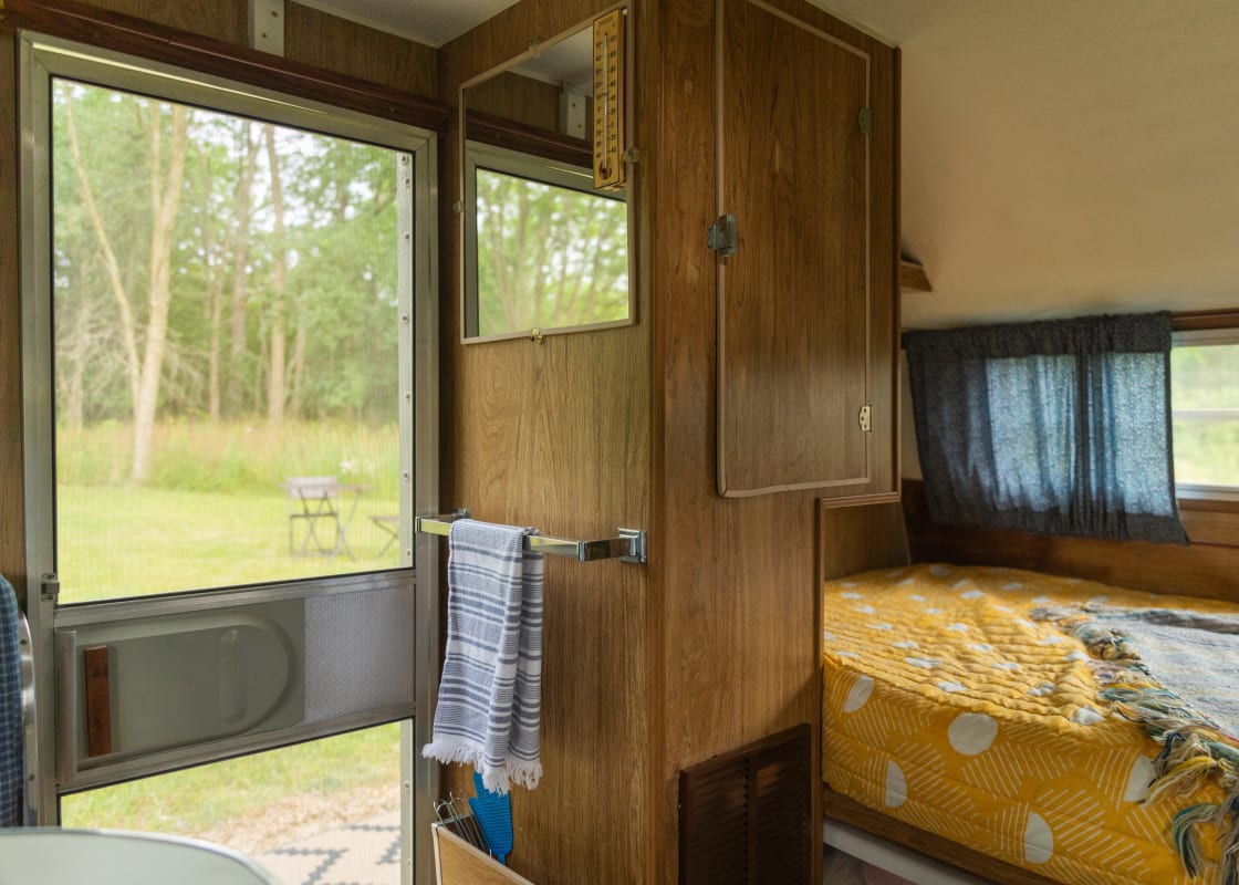 Nice breeze comes through the screened in door within the camper