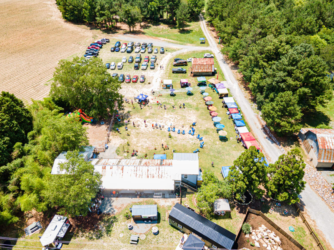 The front part of the farm - where we hold events. Your spot is beyond the woods at the top of picture!