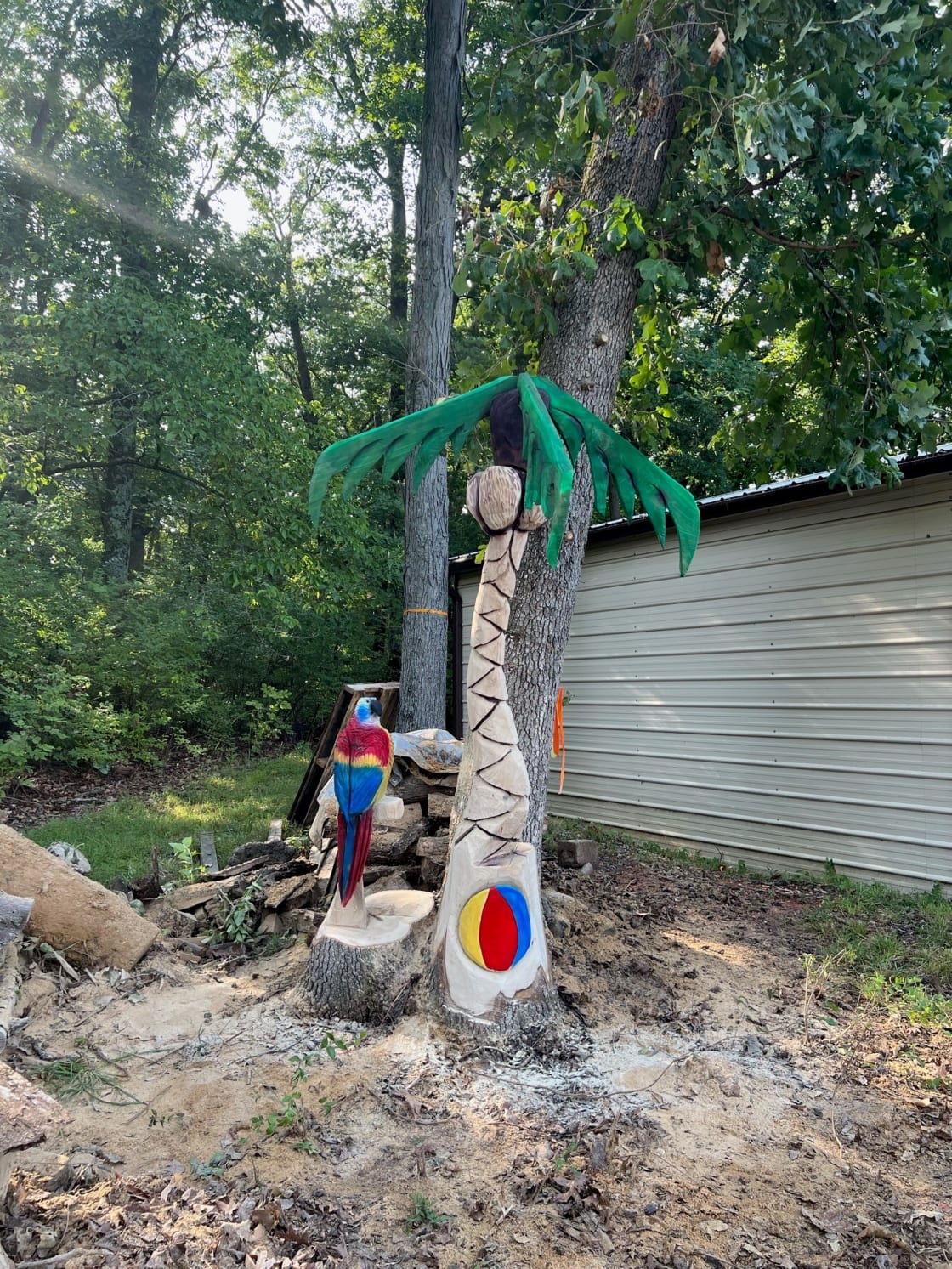 "Welcome to paradise" wood sculpture on our property.