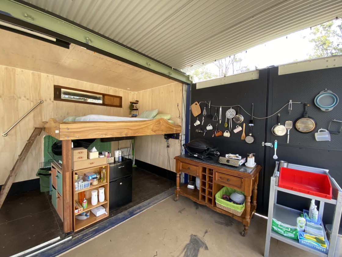 Kitchen includes hot plate, barbecue, fridge, utensils and sink. 