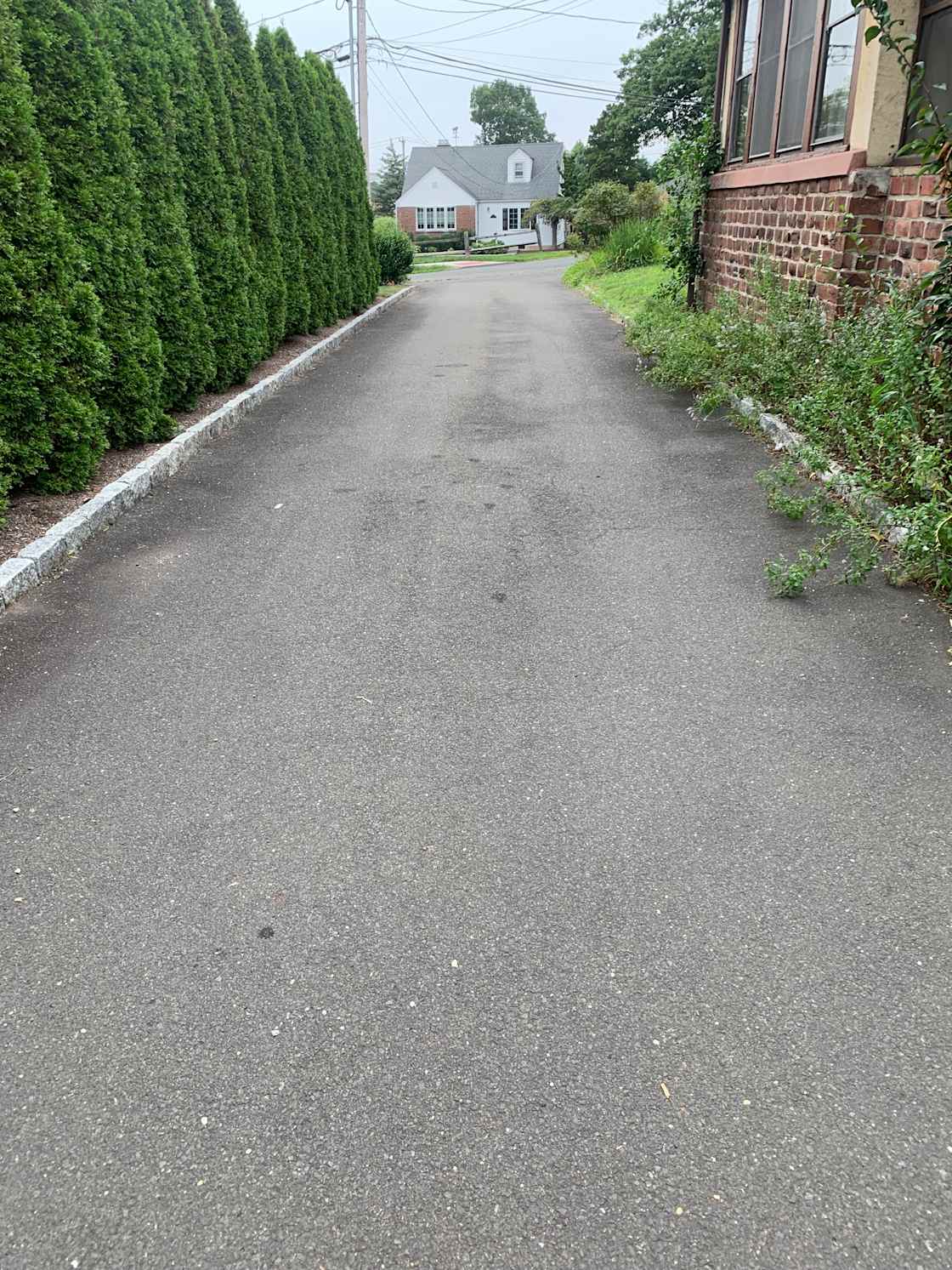 The driveway is 11' 5" wide.   RV Slides not permitted. 