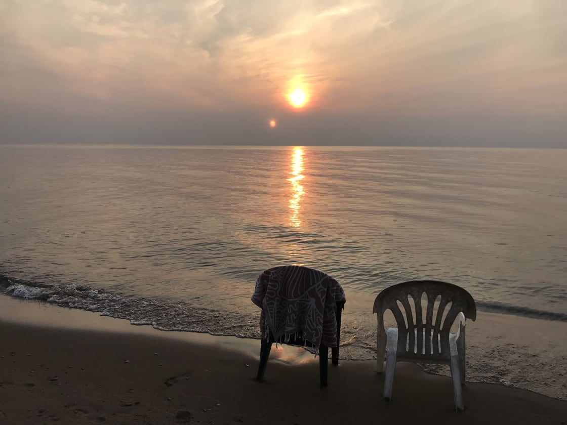 Sunset at the beach! Chairs provided by host. 