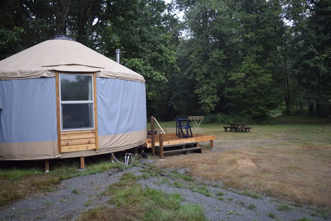South side of the yurt with deck and picnic table 