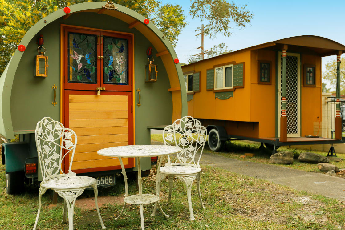 2 gypsy caravans at the front of the house - little green sleeps 2, bigger brown sleeps 4