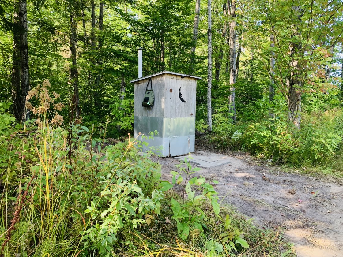 There’s an outhouse with a solar shower bag not far from camp. 