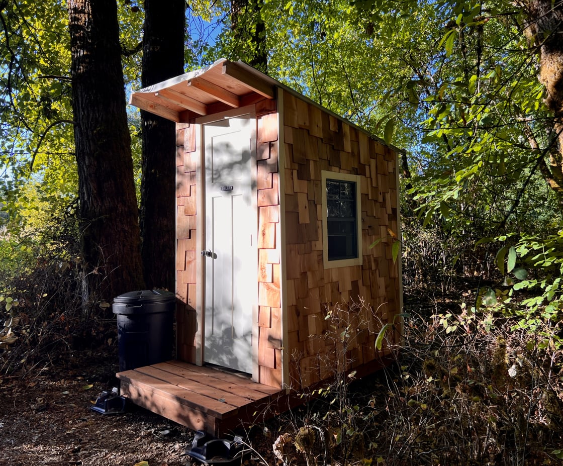 Private outhouse with composting toilet.