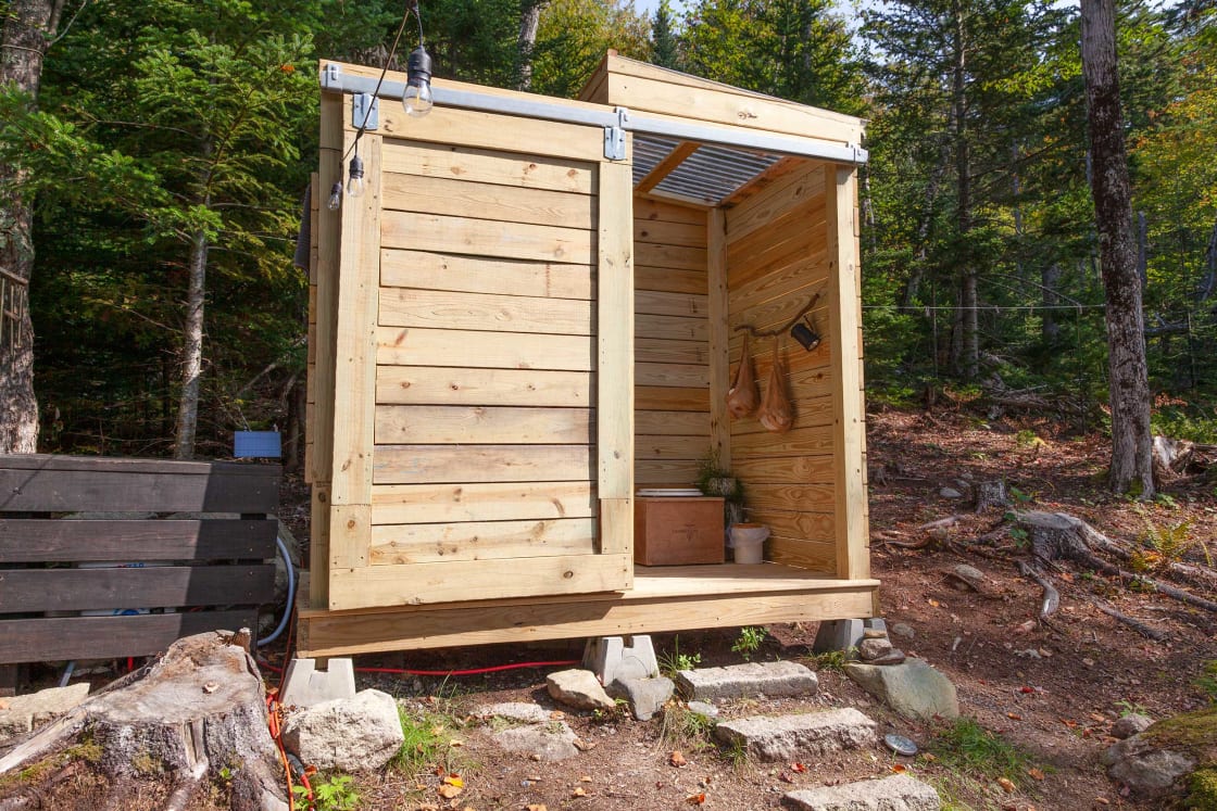 New! Outdoor bathroom with a Loveable Loo composting toilet. The Loveable Loo composting toilet has compostable bags inside to contain the compost.