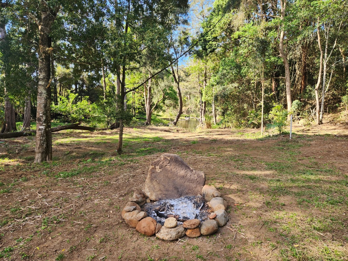 Enjoy the campfire while watching the creek