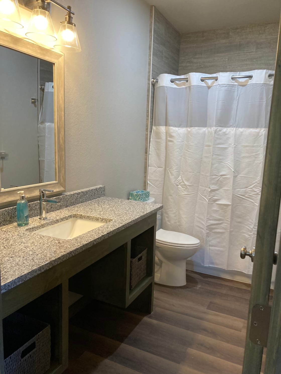 Bathroom located off living area. Shower/tub combo.
