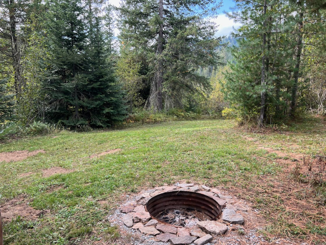 The fire pit and a small meadow next to the RV Site, a perfect place to hang with the family or get a bacci or corn hole game going.