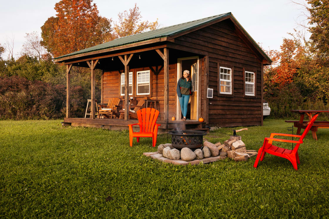 The covered porch, chairs, firepit and picnic table are all just a few steps away from the cabin. 
