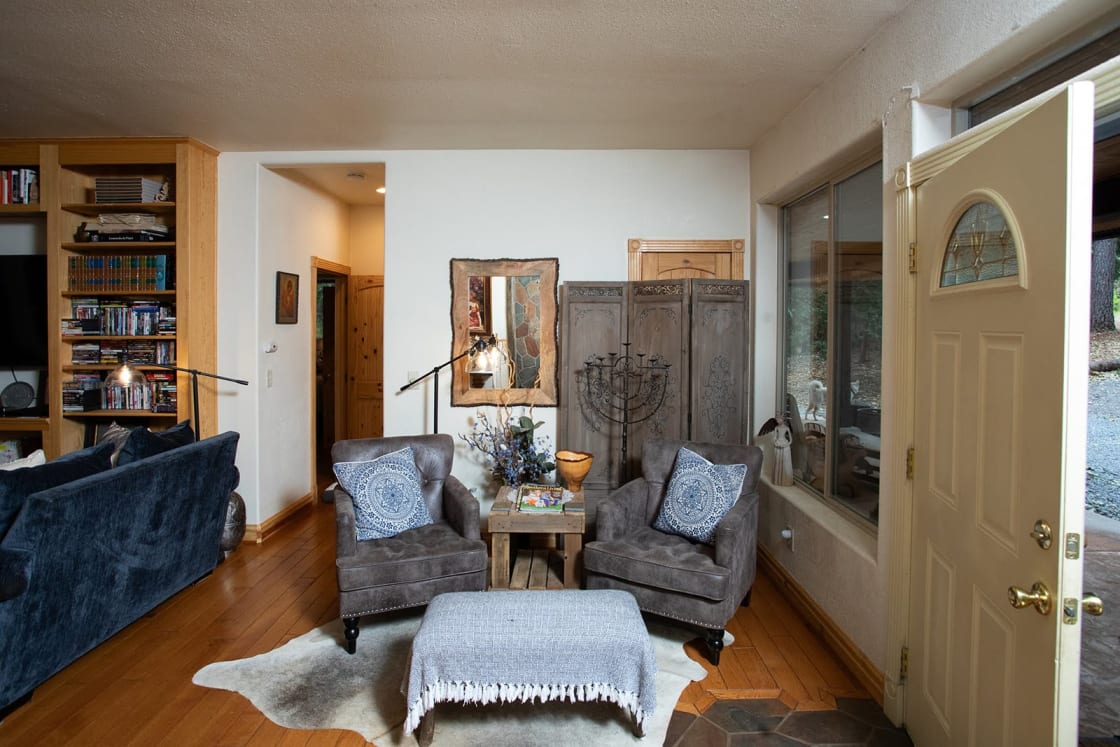 Cozy up in the reading nook directly across from the wood-burning stove and next to the large entryway window.
