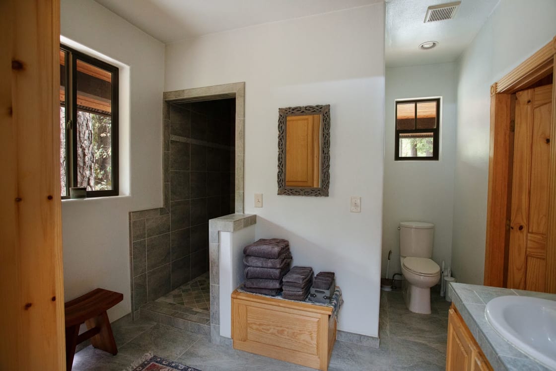 The main floor bathroom is open, spacious, fully-equipped and accessible for all guests.