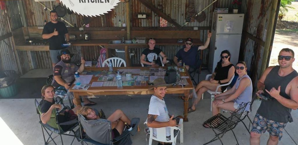 A group of campers enjoying the bush kitchen before heading over to K'gari (Fraser Island)