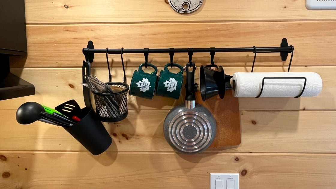 Kitchen rack with cooking supplies