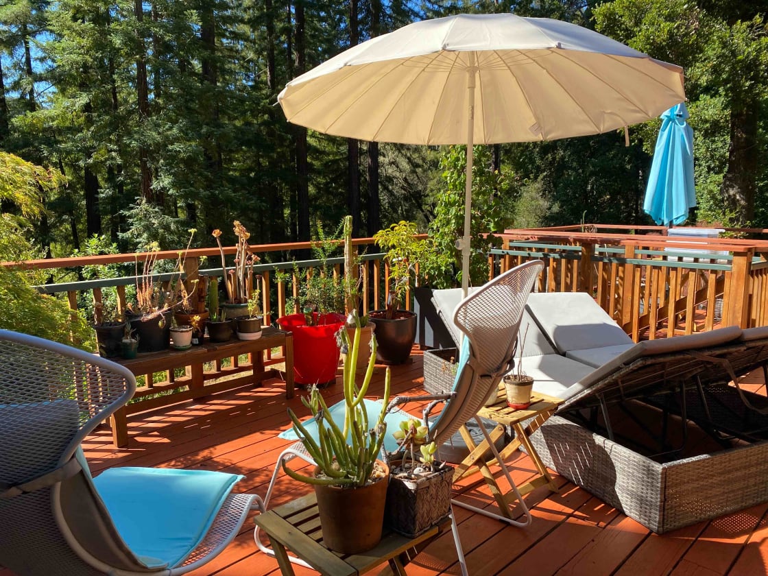 Back deck area - available for all to use. There is a small table setting in the back - behind the blue umbrella. Seats 4.