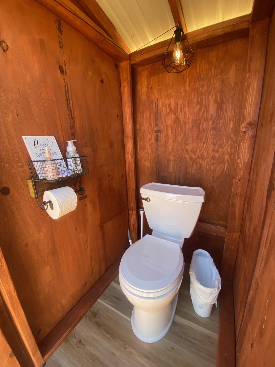 Enjoy your own PRIVATE and clean outhouse! Just a few steps off your wrap around deck, you get to enjoy your own flushing toilet equipped with everything you need to feel comfortable! Your outhouse is even lit by a solar powered light! 